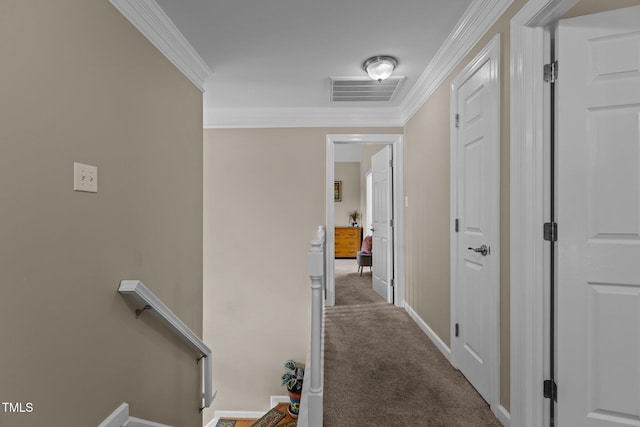 hall featuring an upstairs landing, crown molding, carpet floors, and visible vents