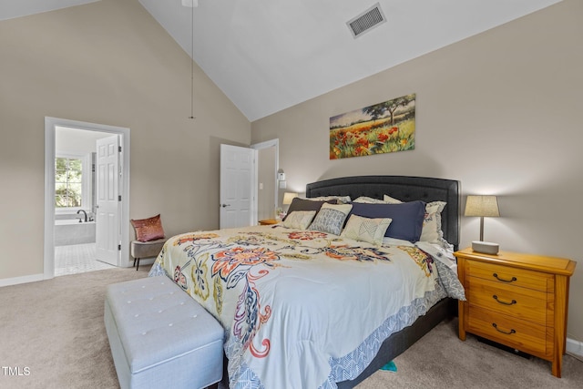 bedroom with high vaulted ceiling, carpet floors, visible vents, baseboards, and ensuite bath