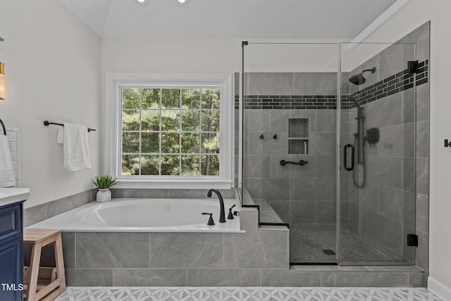 bathroom with a shower stall, a garden tub, and vanity