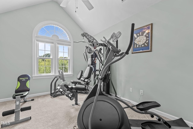 exercise room featuring baseboards, carpet flooring, ceiling fan, and vaulted ceiling