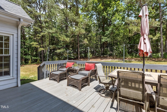 deck with outdoor dining area
