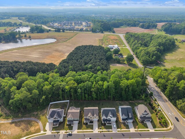 drone / aerial view with a residential view and a water view