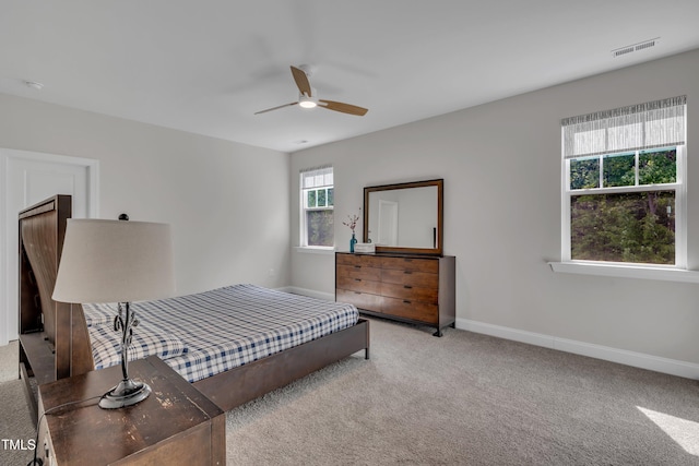bedroom featuring baseboards, carpet, and visible vents