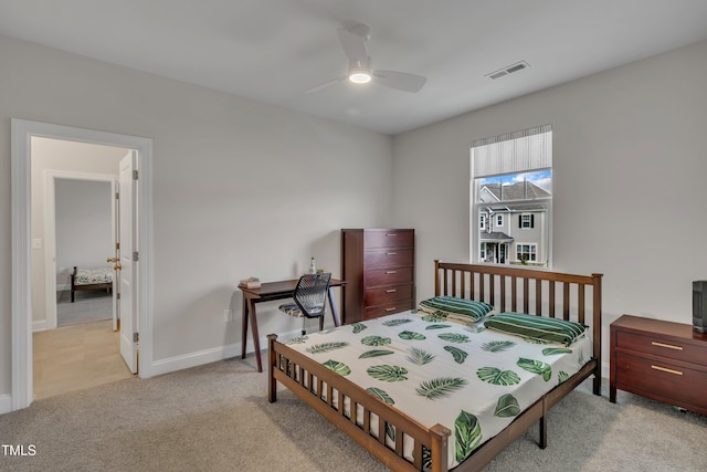 bedroom with baseboards, a ceiling fan, light colored carpet, and visible vents