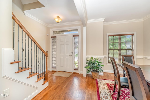 106 Jordan Creek Dr, Jamestown, NC 27282 - foyer featuring crown molding, baseboards, wood finished floors, and stairway