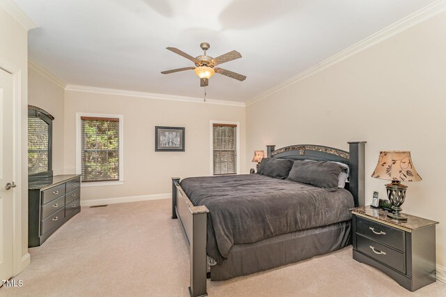 106 Jordan Creek Dr, Jamestown, NC 27282 - bedroom featuring crown molding, baseboards, light carpet, and a ceiling fan