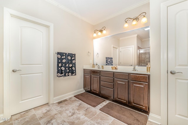 106 Jordan Creek Dr, Jamestown, NC 27282 - bathroom featuring crown molding, double vanity, baseboards, and a sink