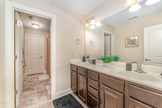 106 Jordan Creek Dr, Jamestown, NC 27282 - bathroom with double vanity, visible vents, and a sink