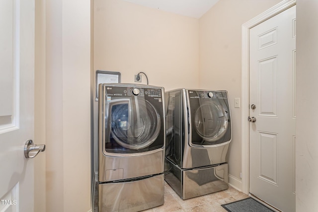 106 Jordan Creek Dr, Jamestown, NC 27282 - laundry room with separate washer and dryer, baseboards, laundry area, and tile patterned floors