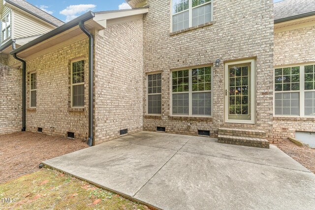 106 Jordan Creek Dr, Jamestown, NC 27282 - rear view of property with brick siding, crawl space, and a patio area