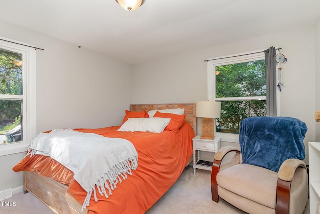 bedroom featuring carpet flooring and visible vents