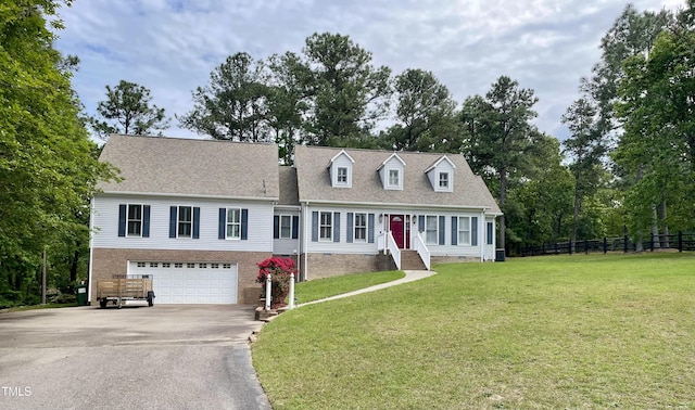 cape cod home featuring fence, an attached garage, driveway, and a front yard