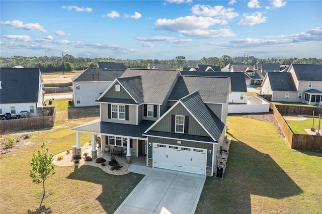 5113 Boxcut Ln, Hope Mills, NC 28348 - view of front of house featuring board and batten siding, covered porch, driveway, a shingled roof, and an attached garage