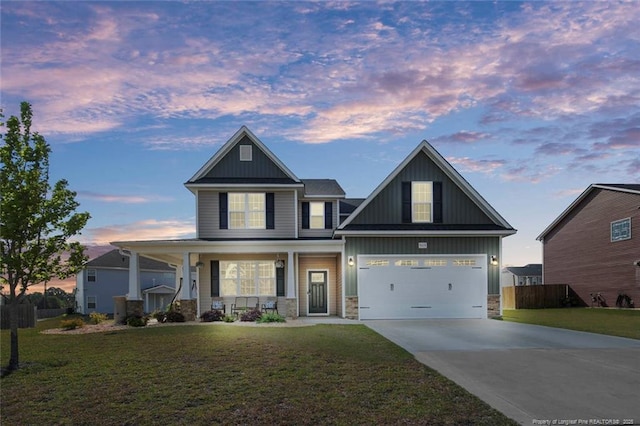 5113 Boxcut Ln, Hope Mills, NC 28348 - craftsman-style home with board and batten siding, concrete driveway, stone siding, and a porch