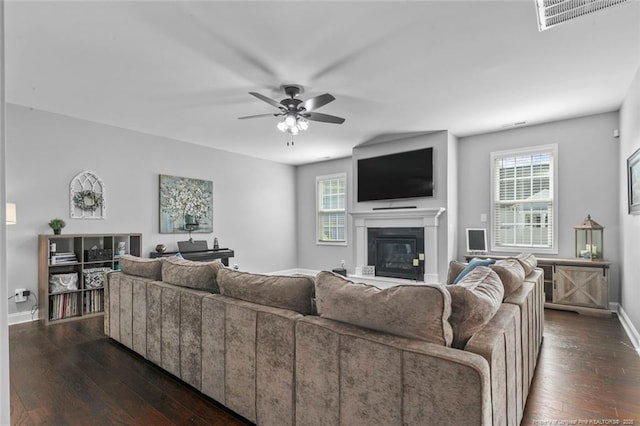 5113 Boxcut Ln, Hope Mills, NC 28348 - living room featuring healthy amount of natural light, baseboards, a ceiling fan, and dark wood finished floors