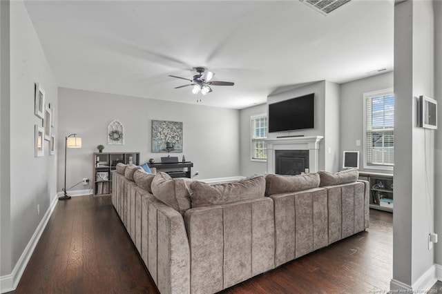 5113 Boxcut Ln, Hope Mills, NC 28348 - living room with a fireplace, a ceiling fan, dark wood-type flooring, and baseboards
