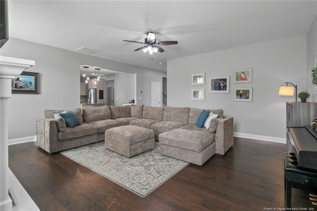 5113 Boxcut Ln, Hope Mills, NC 28348 - living area featuring dark wood-type flooring, ceiling fan, and baseboards