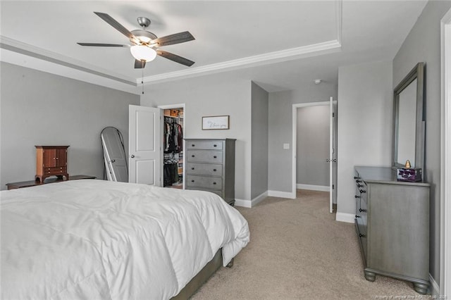 5113 Boxcut Ln, Hope Mills, NC 28348 - bedroom with light carpet, a walk in closet, baseboards, a closet, and ceiling fan