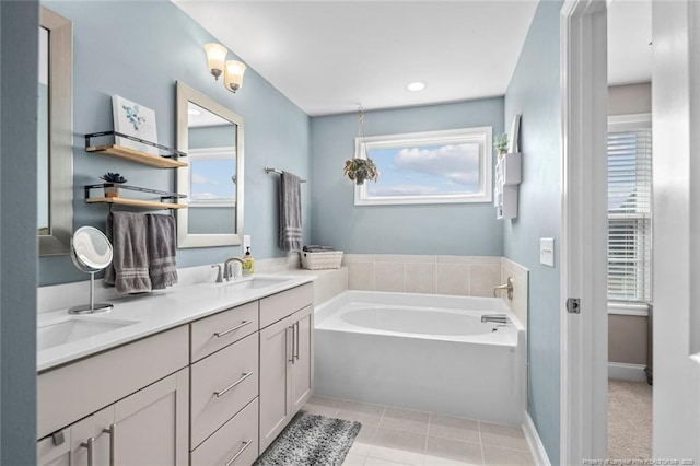 5113 Boxcut Ln, Hope Mills, NC 28348 - full bathroom featuring a bath, healthy amount of natural light, double vanity, and tile patterned flooring