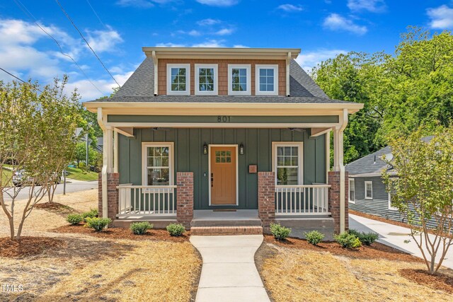 801 N Elm St, Durham, NC 27701 - view of front of home featuring board and batten siding, a shingled roof, and a porch