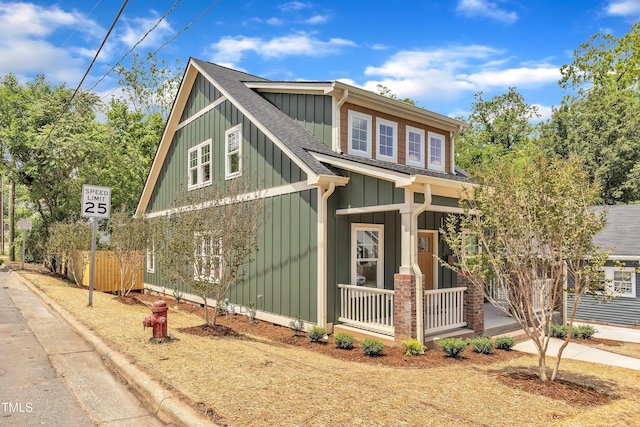 801 N Elm St, Durham, NC 27701 - view of side of property featuring covered porch, board and batten siding, and a shingled roof