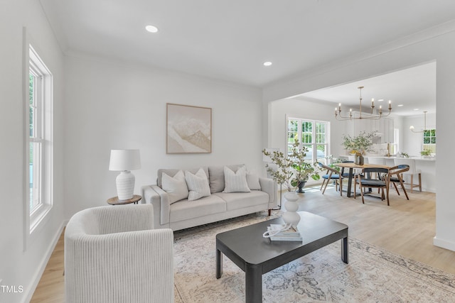 801 N Elm St, Durham, NC 27701 - living area featuring recessed lighting, baseboards, light wood finished floors, and a notable chandelier