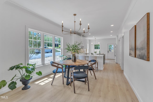 801 N Elm St, Durham, NC 27701 - dining room with an inviting chandelier, baseboards, and light wood-style flooring