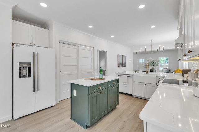 801 N Elm St, Durham, NC 27701 - kitchen featuring light wood-style floors, white refrigerator with ice dispenser, green cabinetry, white cabinets, and dishwasher