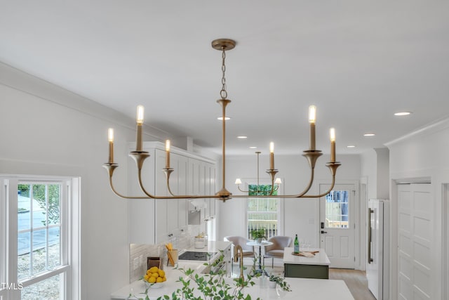 801 N Elm St, Durham, NC 27701 - interior space with pendant lighting, black electric cooktop, freestanding refrigerator, light wood finished floors, and recessed lighting