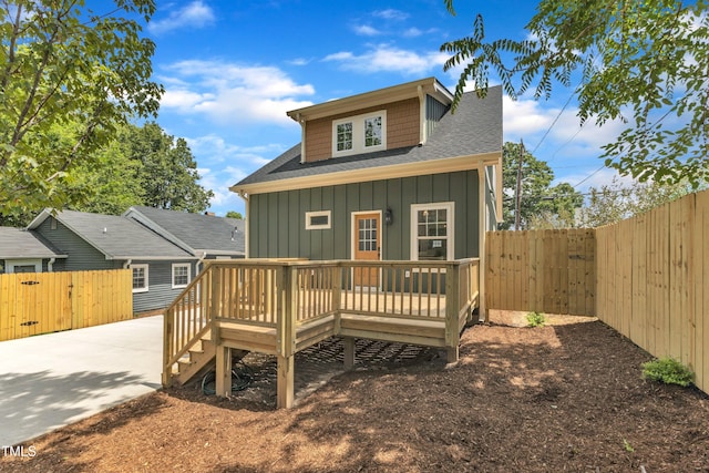 801 N Elm St, Durham, NC 27701 - rear view of property with board and batten siding, a deck, a shingled roof, and a fenced backyard