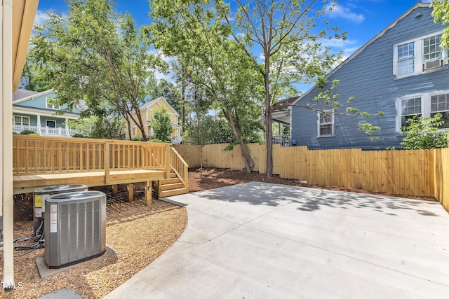 801 N Elm St, Durham, NC 27701 - view of patio featuring a fenced backyard, a deck, and central AC unit