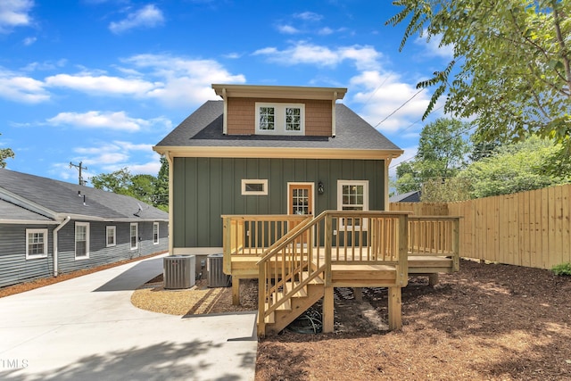 801 N Elm St, Durham, NC 27701 - rear view of property with fence, a wooden deck, cooling unit, roof with shingles, and board and batten siding