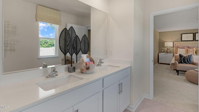196 Ethel Ln, Angier, NC 27501 - ensuite bathroom with baseboards, a sink, ensuite bath, and double vanity