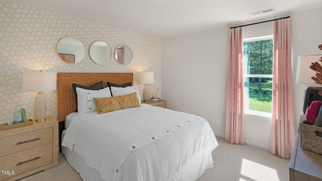 196 Ethel Ln, Angier, NC 27501 - bedroom featuring light colored carpet, baseboards, visible vents, and an accent wall