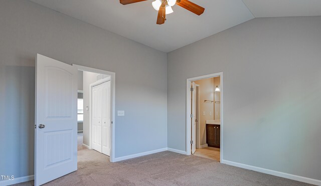 14 Prairie View Ct, Durham, NC 27703 - unfurnished bedroom with vaulted ceiling, light carpet, ensuite bath, baseboards, and a ceiling fan