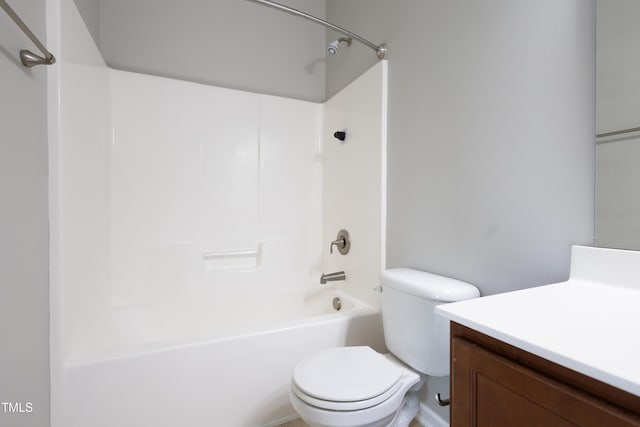 bathroom featuring vanity, toilet, and bathing tub / shower combination