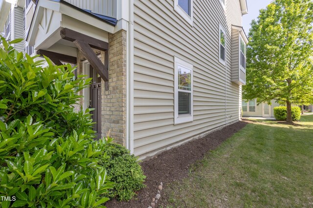 14 Prairie View Ct, Durham, NC 27703 - view of side of property with a yard and brick siding