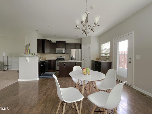14 Prairie View Ct, Durham, NC 27703 - dining room featuring dark wood-type flooring, a chandelier, baseboards, and recessed lighting