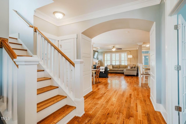 281 N Serenity Hill Cir, Chapel Hill, NC 27516 - foyer entrance featuring arched walkways, crown molding, stairs, and light wood finished floors