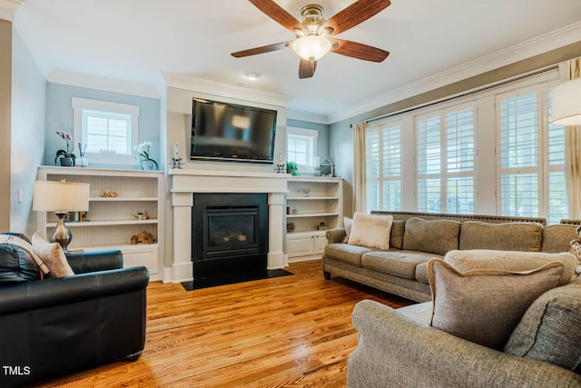 281 N Serenity Hill Cir, Chapel Hill, NC 27516 - living area featuring light wood-style flooring, a ceiling fan, crown molding, and a fireplace with flush hearth
