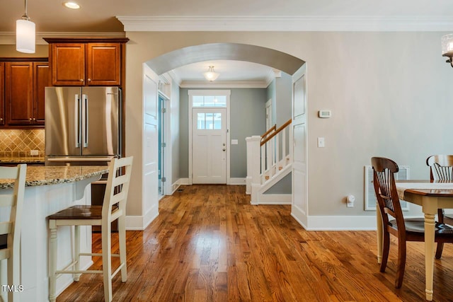 281 N Serenity Hill Cir, Chapel Hill, NC 27516 - foyer entrance with arched walkways, ornamental molding, wood finished floors, baseboards, and recessed lighting