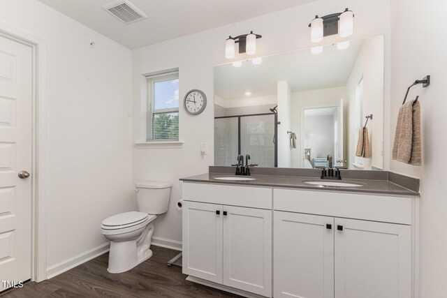 138 Rialto St, Chapel Hill, NC 27516 - bathroom featuring a sink, toilet, baseboards, visible vents, and a stall shower