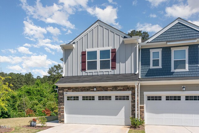 138 Rialto St, Chapel Hill, NC 27516 - multi unit property featuring concrete driveway, board and batten siding, an attached garage, and stone siding