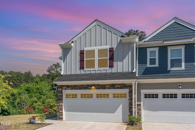 138 Rialto St, Chapel Hill, NC 27516 - multi unit property with a garage, board and batten siding, driveway, and stone siding