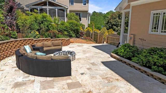 view of patio with an outdoor hangout area and fence