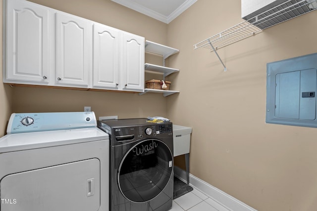 laundry room with ornamental molding, baseboards, electric panel, separate washer and dryer, and cabinet space