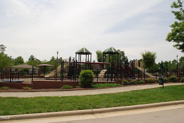 community jungle gym featuring fence