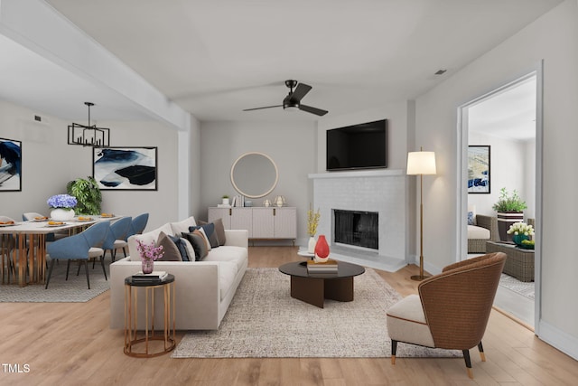 1304 Seaton Rd Unit 24, Durham, NC 27713 - living room with wood finished floors, a fireplace, baseboards, and ceiling fan