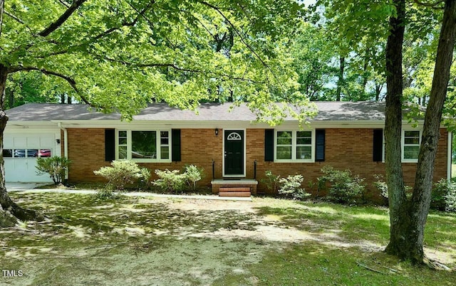 1713 S Garnett St, Henderson, NC 27536 - ranch-style home with an attached garage and brick siding