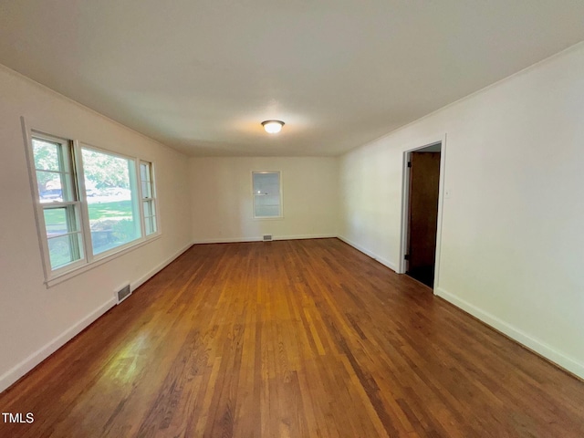 1713 S Garnett St, Henderson, NC 27536 - empty room with wood finished floors and baseboards